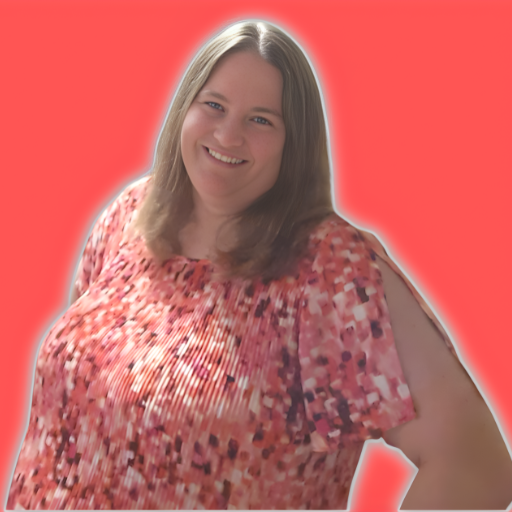 Lori in a pink shirt with a coral background.